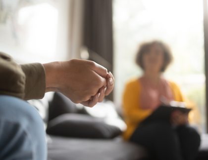 A woman receiving mental health counseling services from a female mental health professional.