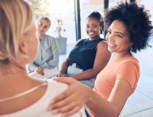 group of women in therapy addressing their mental health challenges.